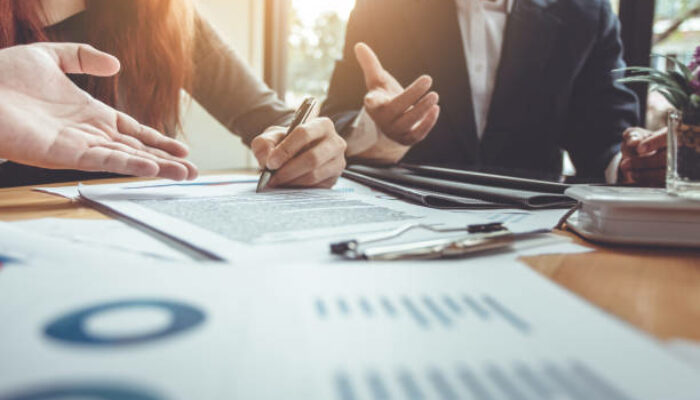 Business Signing a Contract Buy - sell house.